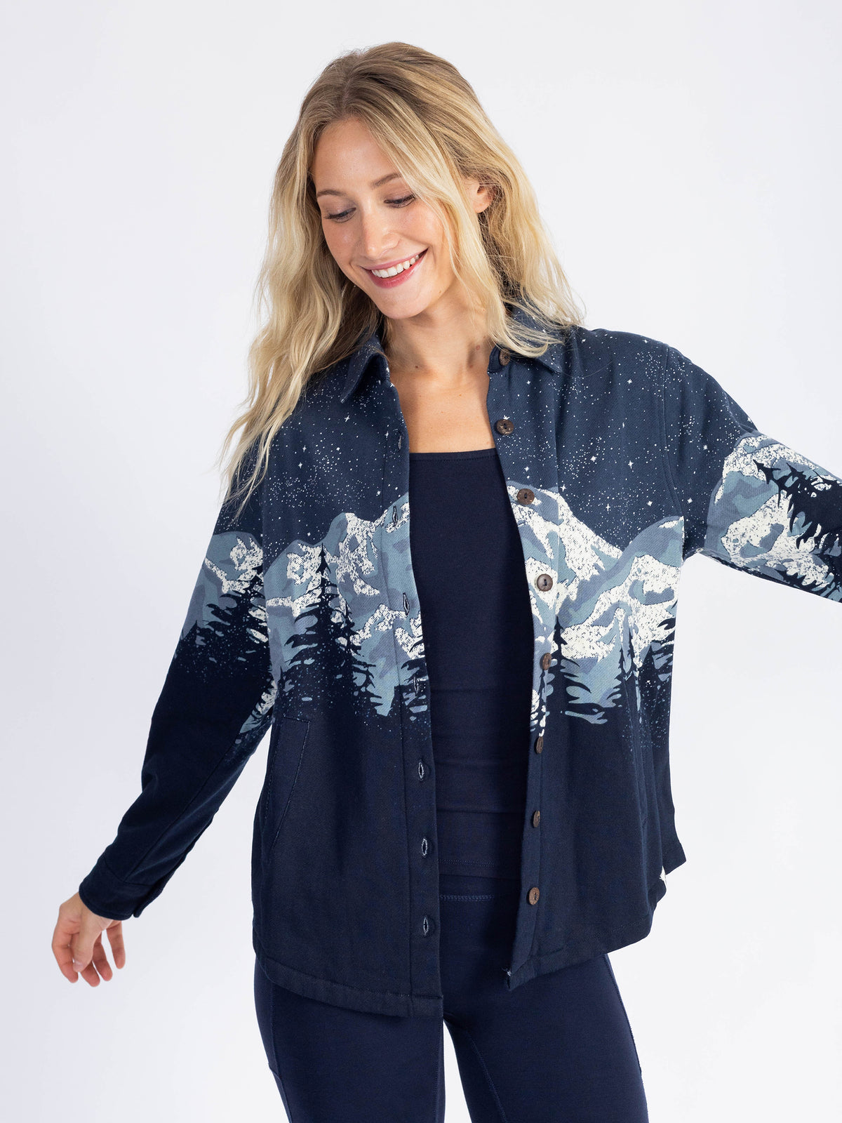 Model wearing the Cascadian Night organic cotton blanket shirt open, arm out