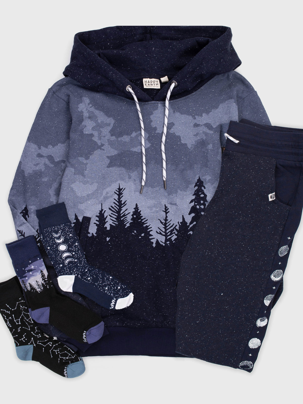 Stardust Hoodie Bundle flat lay: Stardust organic cotton hoodie, Moonshine sweatpants, and Constellations, Starlit Night and Moonshine socks