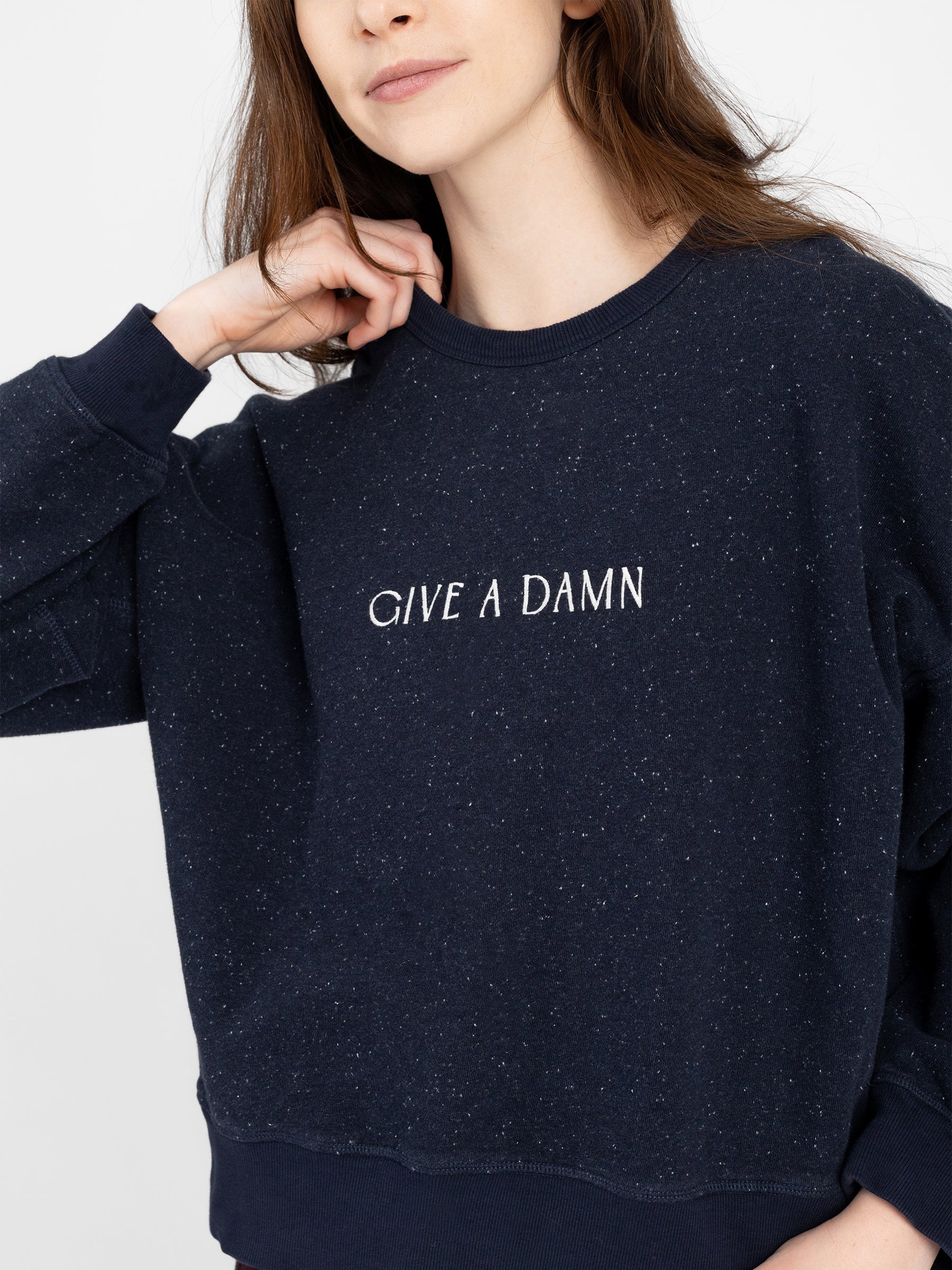 "GIVE A DAMN" embroidered pullover detail, PFAS-free