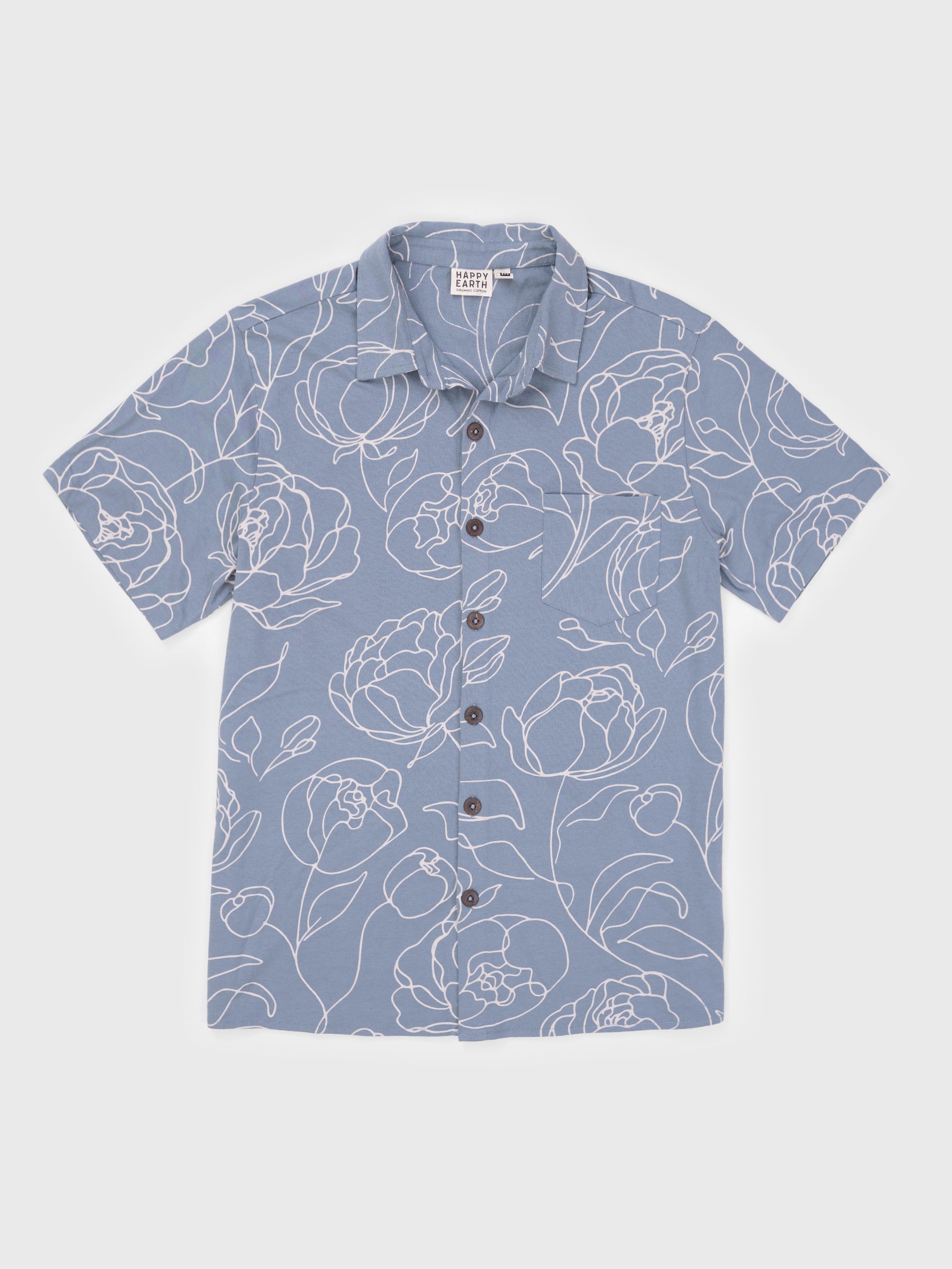 Rincon Shirt in Garden Rose, a blue organic cotton jersey button-up with white hand-drawn roses and wooden buttons.