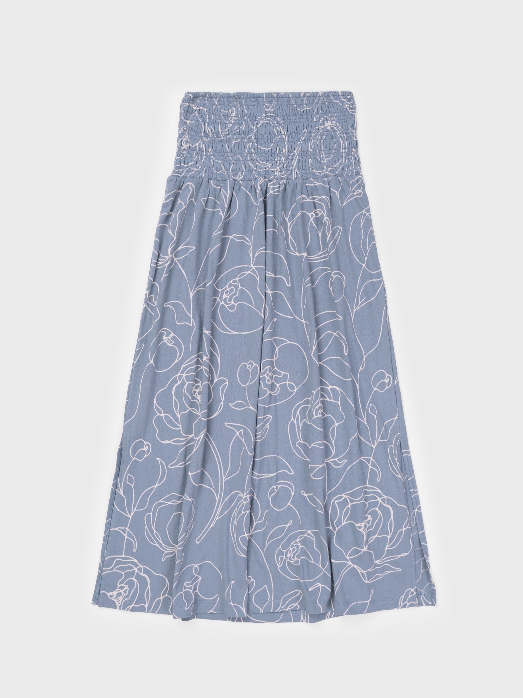 Smocked maxi skirt in Garden Rose print, featuring white and light blue hand-drawn roses on organic cotton.
