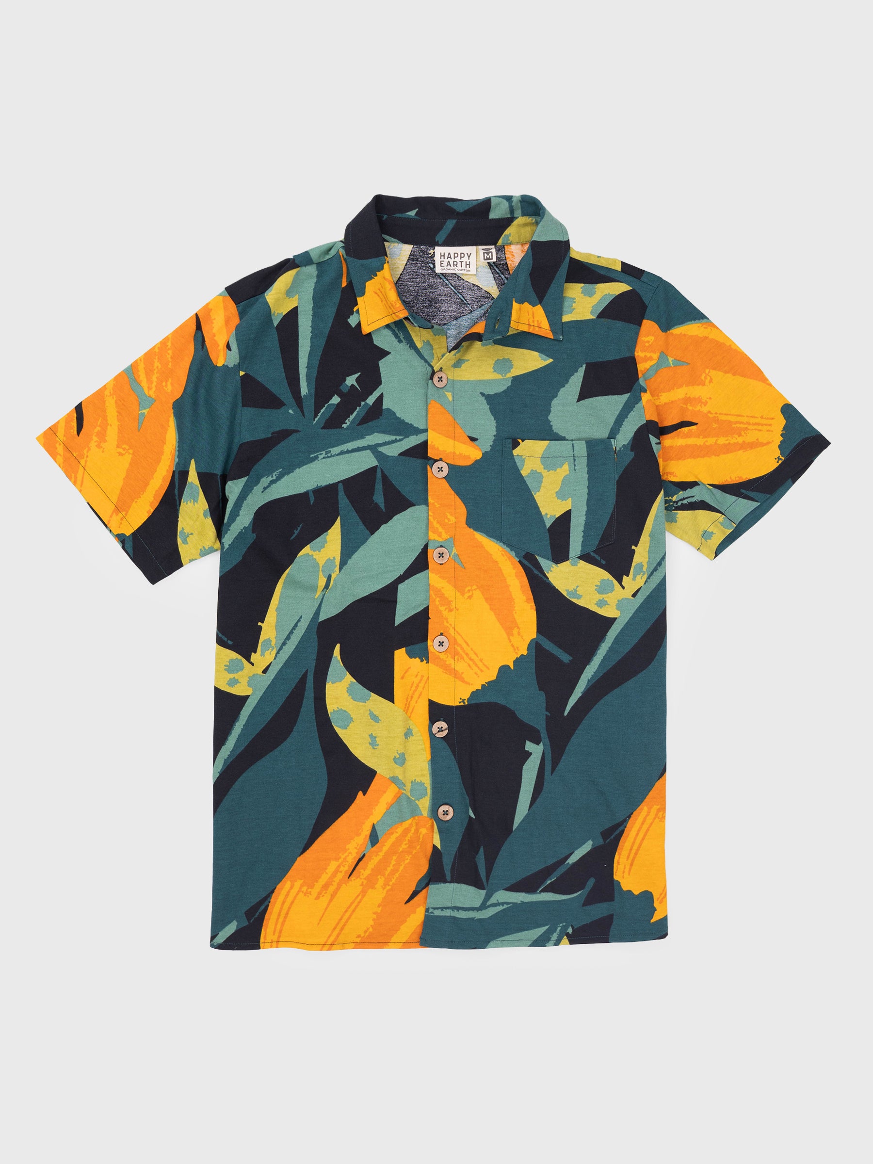 Rincon Shirt in Hanalei print: dark green, black, and golden orange tropical organic cotton jersey with wooden buttons.