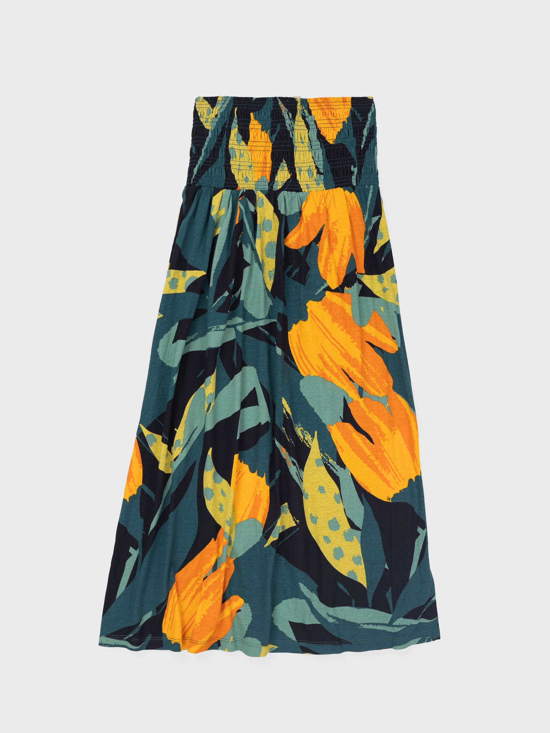 Hanalei Smocked Skirt: organic cotton maxi skirt with a wide smocked waistband and vibrant green and golden floral print.