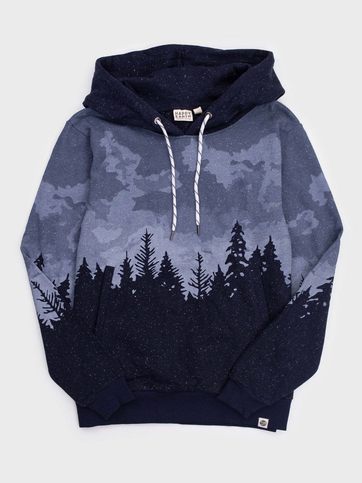 Flat lay of the Stardust organic cotton hoodie, blue cloudy sky over a navy pine forest