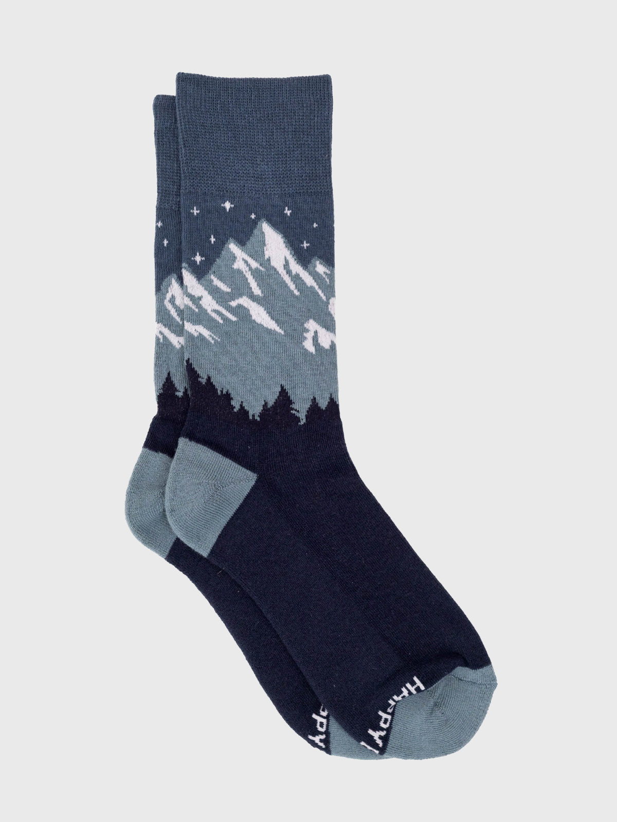 Flat lay of the Cascadian Night organic cotton crew socks, snowy mountains under a starry slate blue sky
