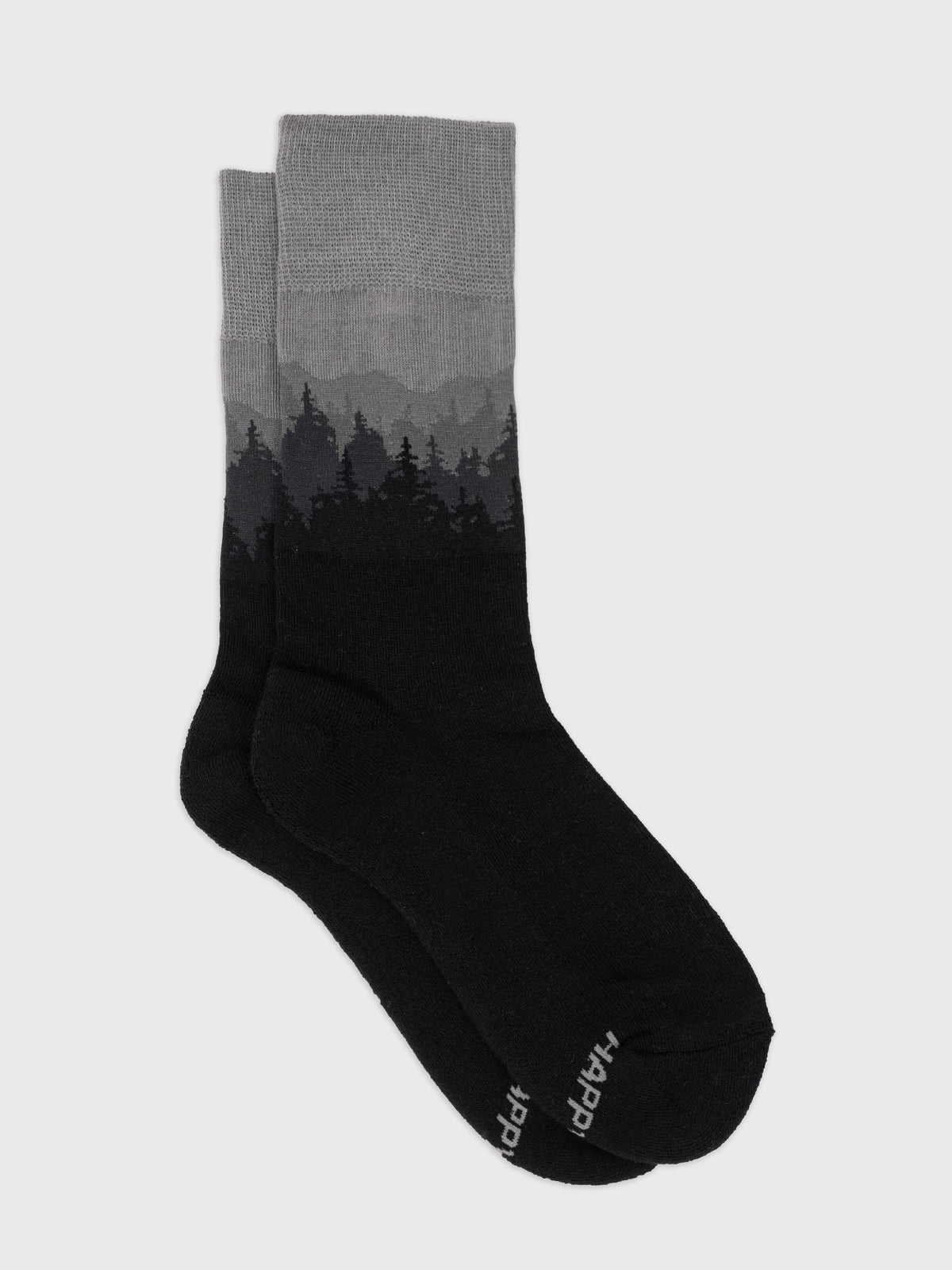 Flat lay of the Dark Frost organic cotton crew socks, gray to black misty pine forest gradient