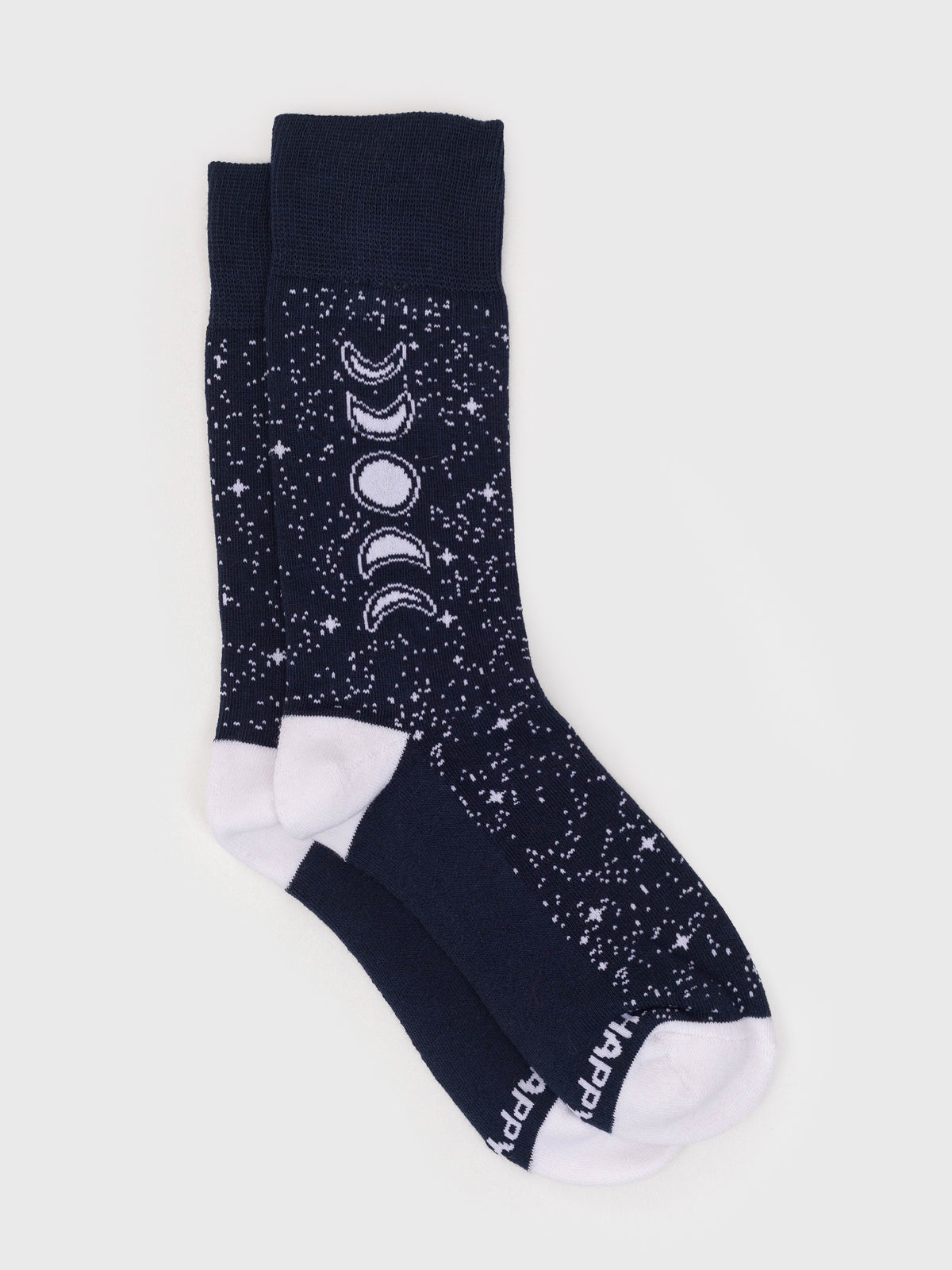 Midnight blue organic cotton socks featuring a white star pattern, moon phases, and Happy Earth text on the toe.
