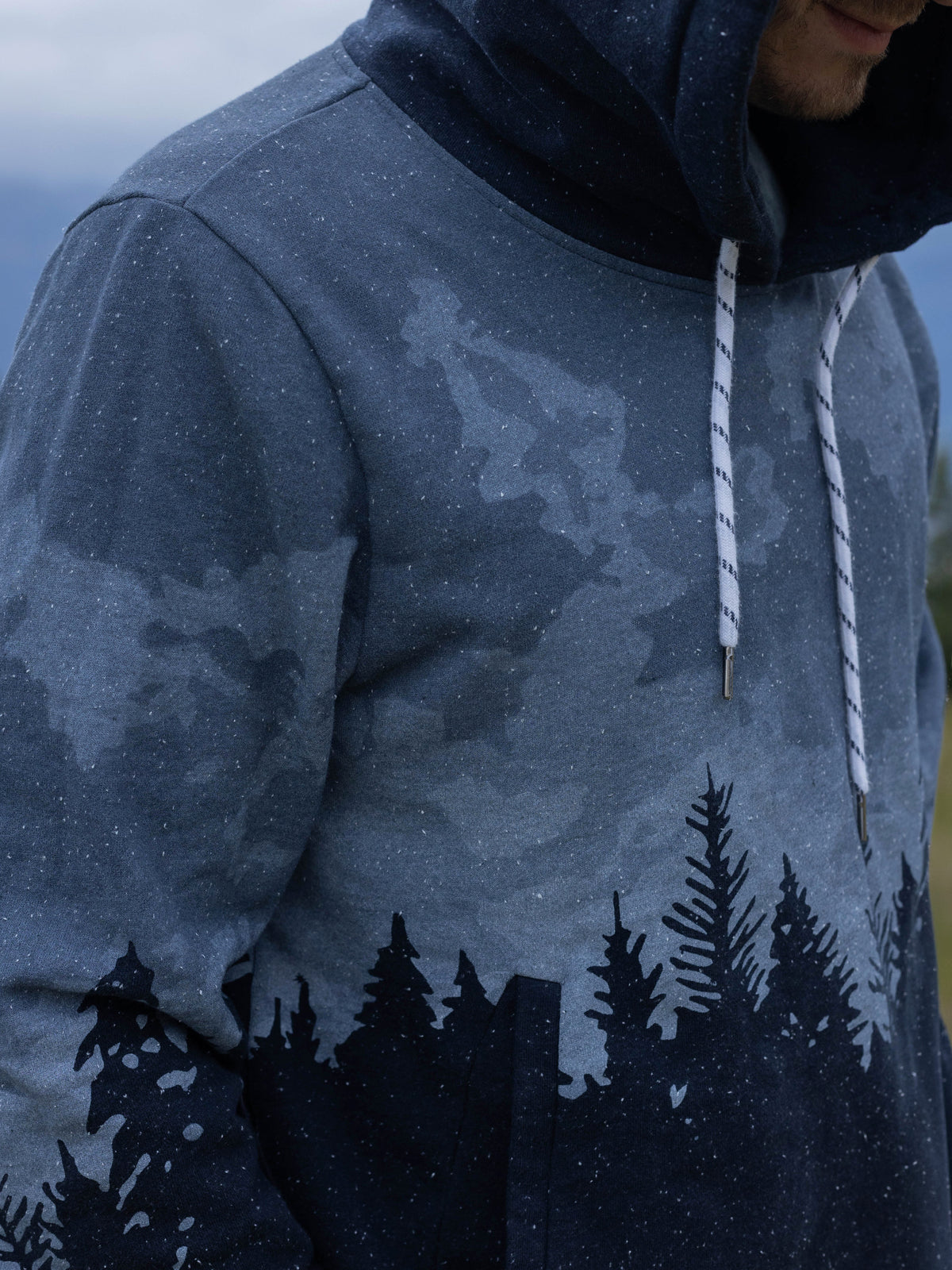 Close-up of the drawstring and pine forest print on the Stardust organic cotton hoodie