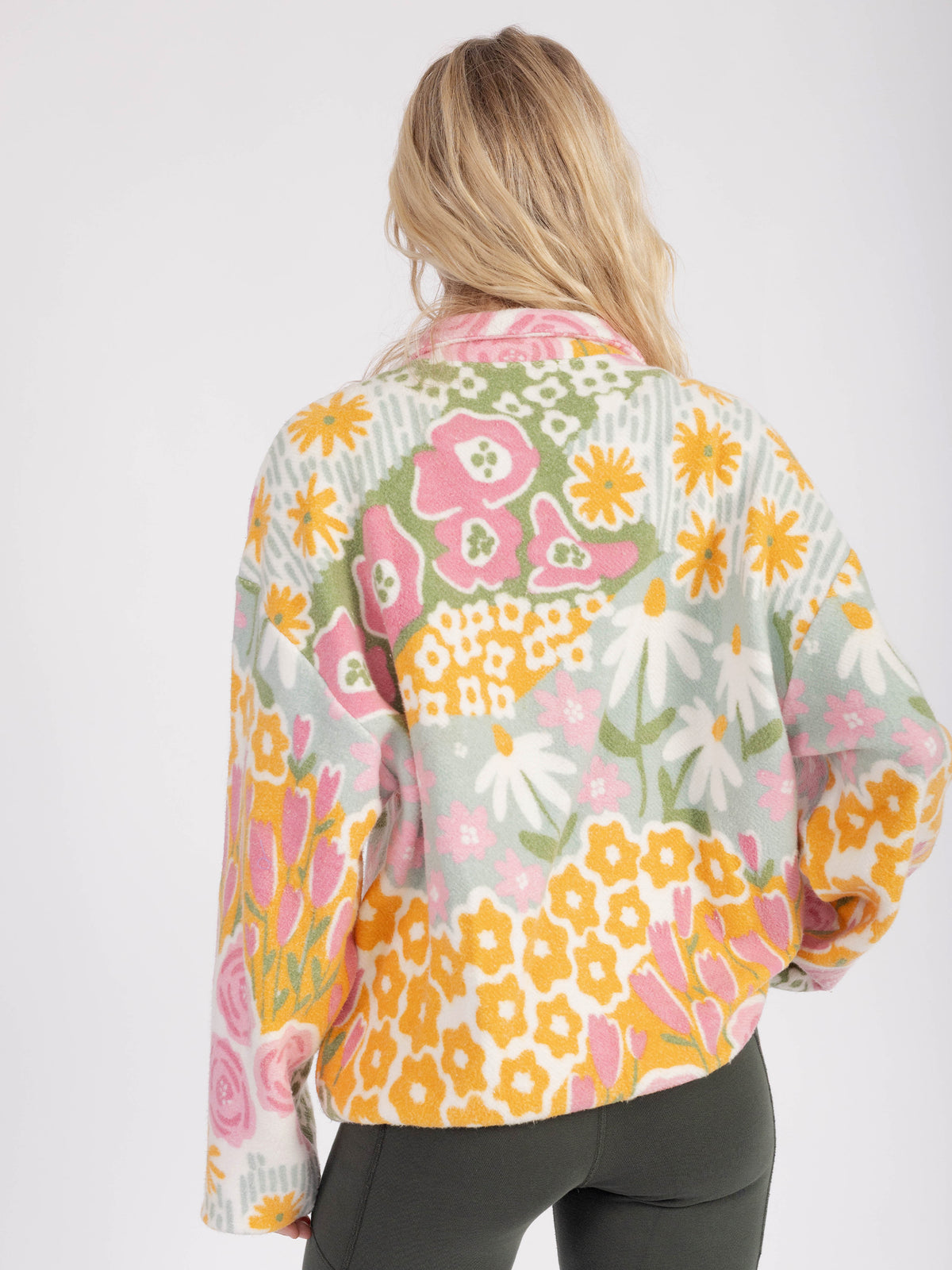 Back view of the Bouquet organic cotton sherpa jacket, roses, daisies and yellow blooms across the back