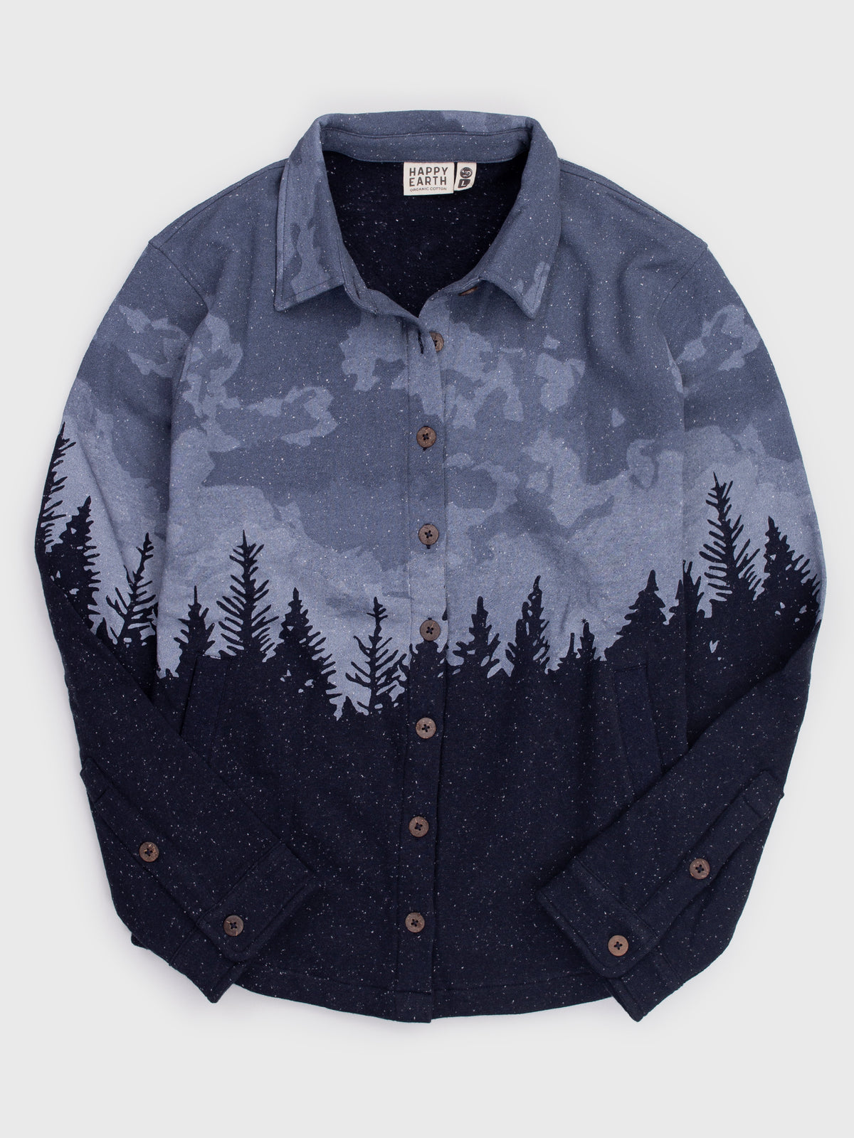Flat lay of the Stardust organic cotton blanket shirt, blue night sky over a navy pine forest, wooden buttons