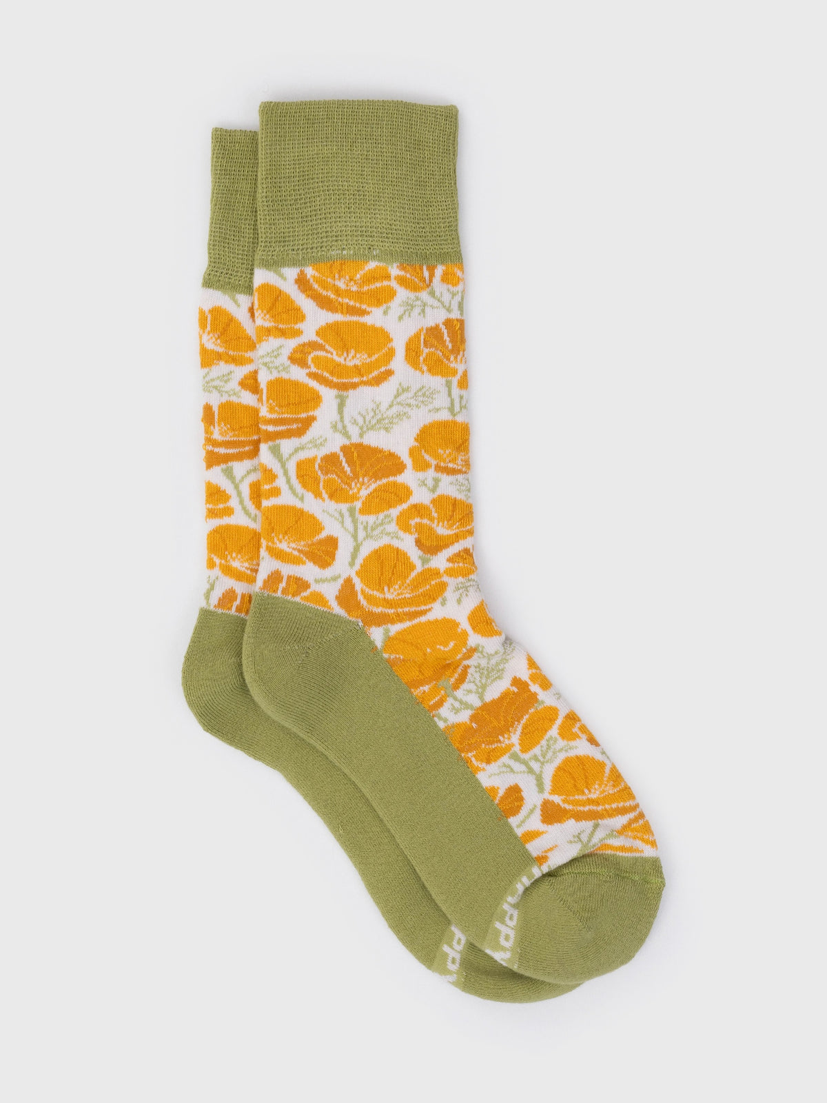 Flat lay of the Poppies organic cotton crew socks, golden poppies with green cuff, heel and toe