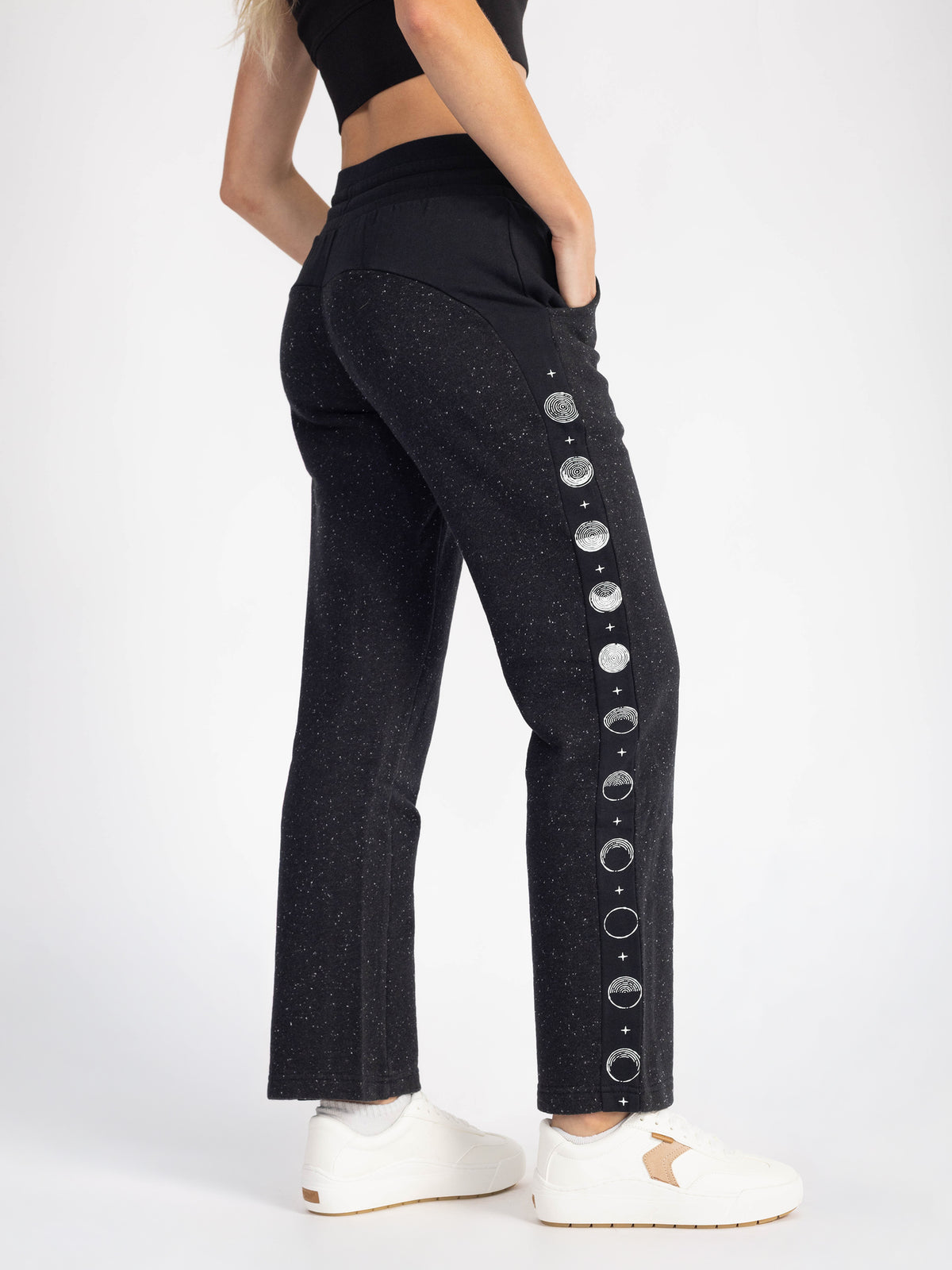 Back view of the speckled black Dark Side organic cotton straight leg sweatpants with moon phase stripe