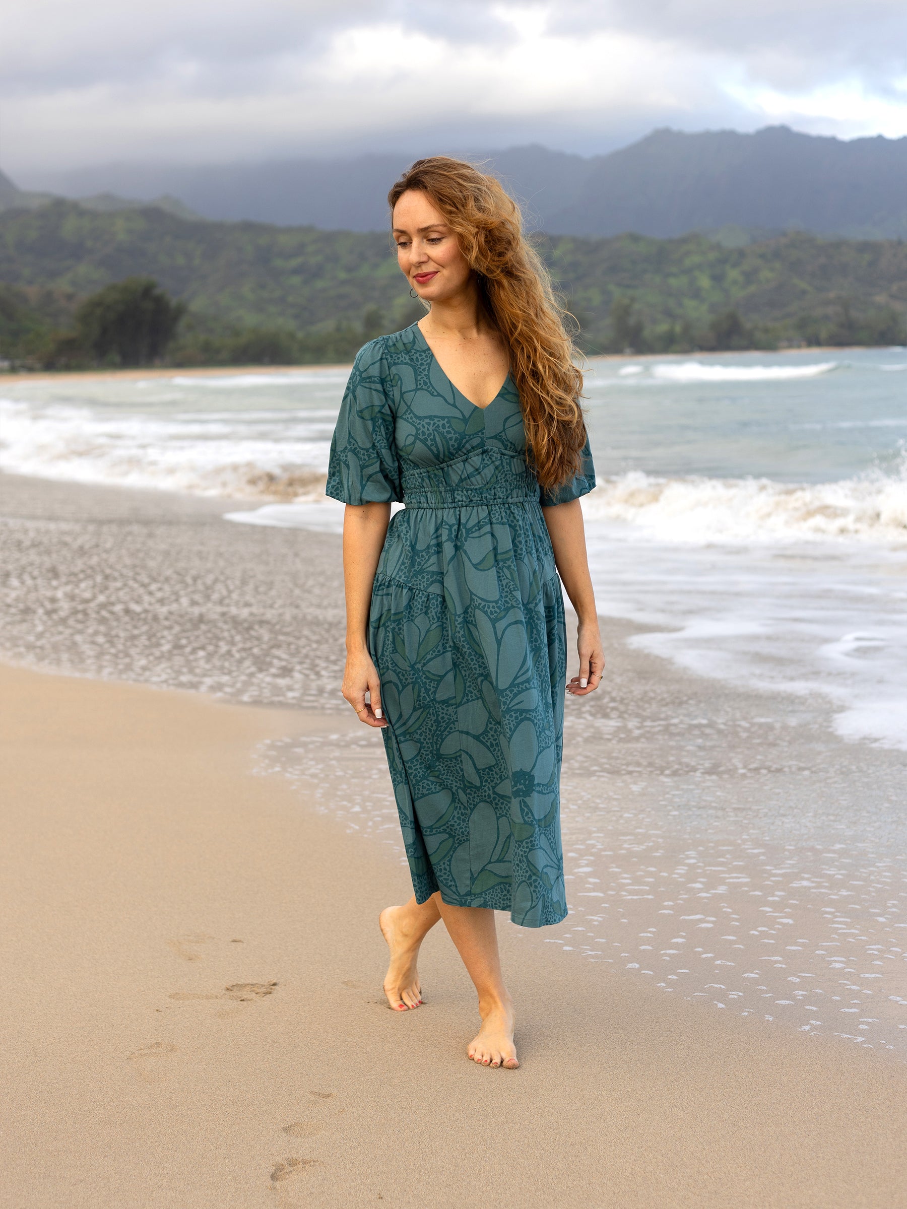 Ophelia Dress in seaside teal organic cotton with large florals, V-neck, puffed sleeves, and smocked waist.