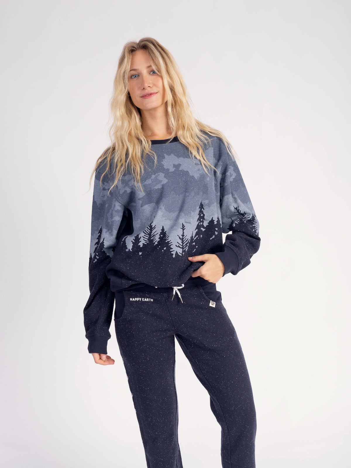 Model wearing the Stardust organic cotton sweatshirt with matching navy sweatpants, full length
