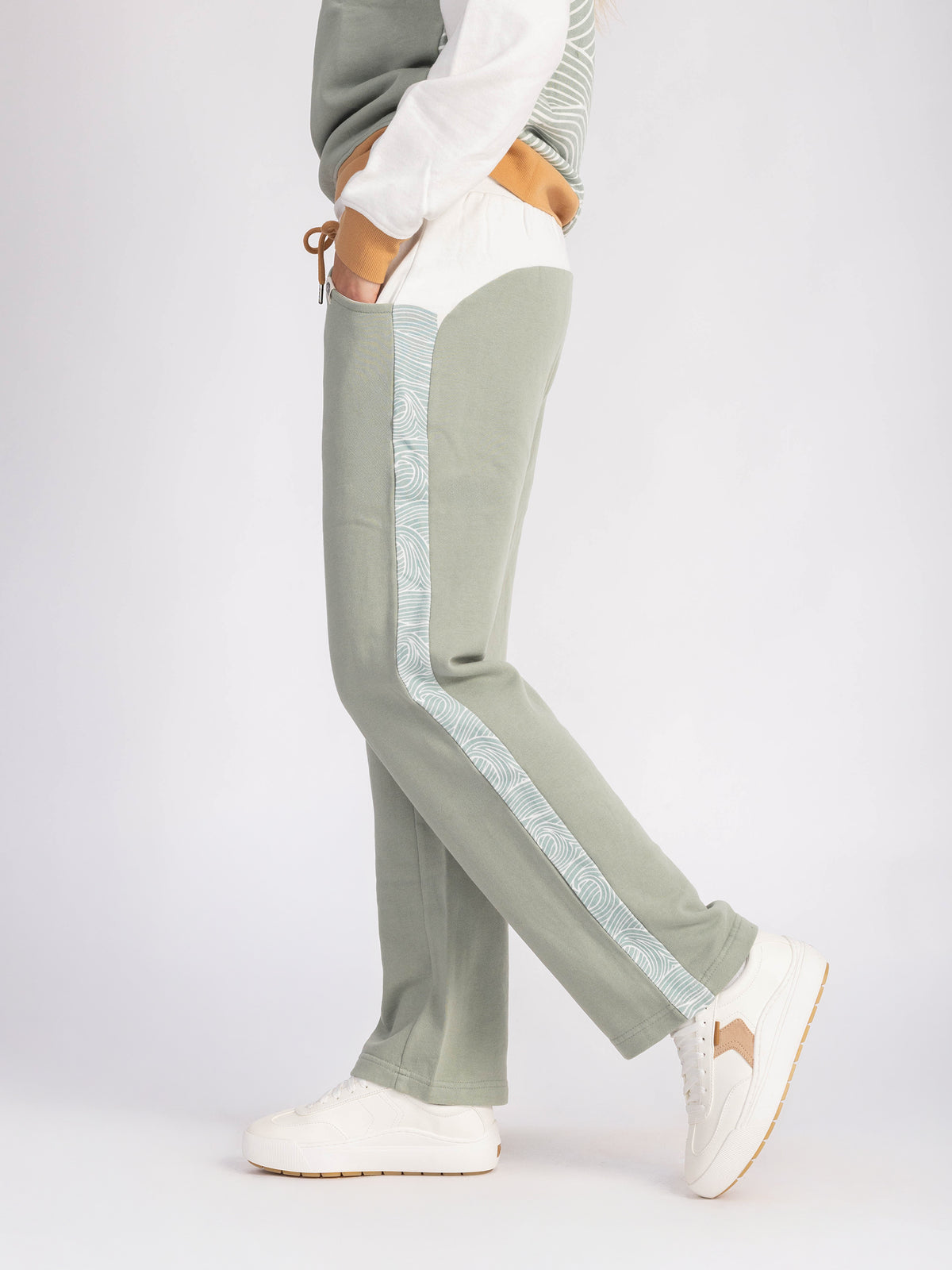 Side view of the seafoam Rolling Seas organic cotton straight leg sweatpants with wave stripe