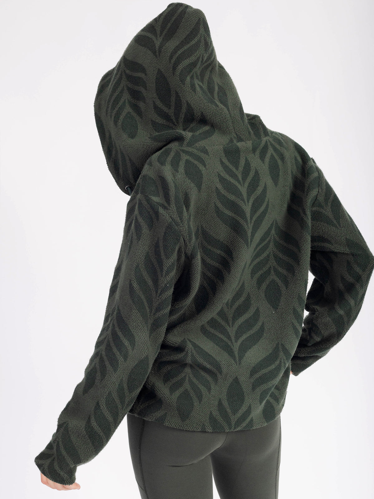 Back view of the Verdant organic cotton sherpa zip hoodie, hood up, leaf pattern across back and hood