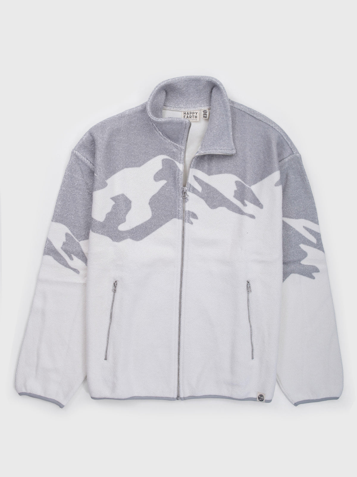 Flat lay of the Altitude organic cotton sherpa jacket in white with a gray mountain range across the shoulders