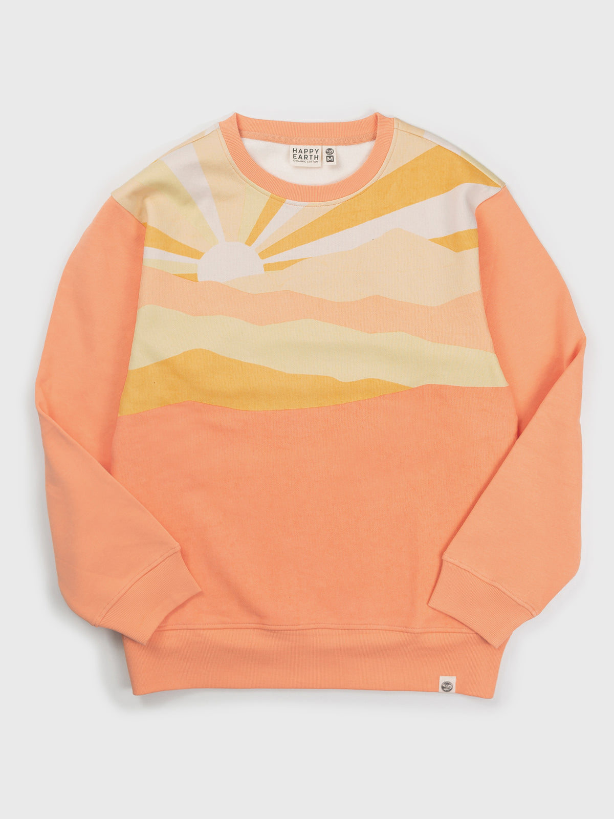 Flat lay of the Sunburst organic cotton sweatshirt in sherbet orange, pastel sunrise rays across the chest and shoulders